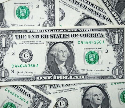 정부, 미 달러화 외평채 발행 공식화…우량 투자자 적극 유치 a pile of one dollar bills laying on top of each other