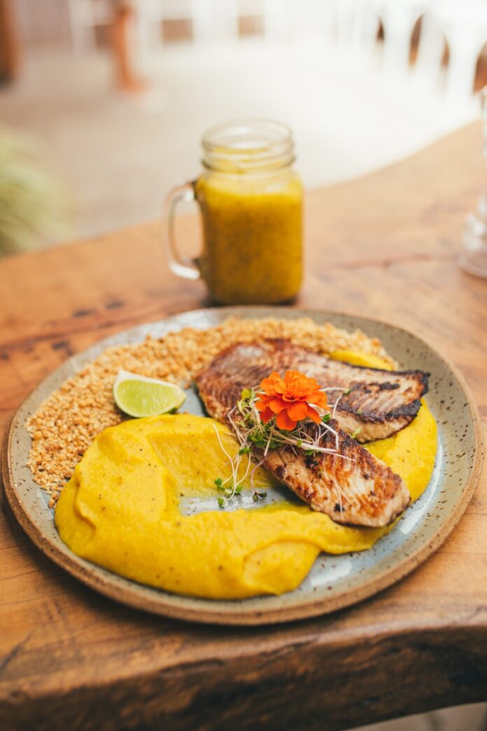 bread with sliced lemon on blue ceramic plate