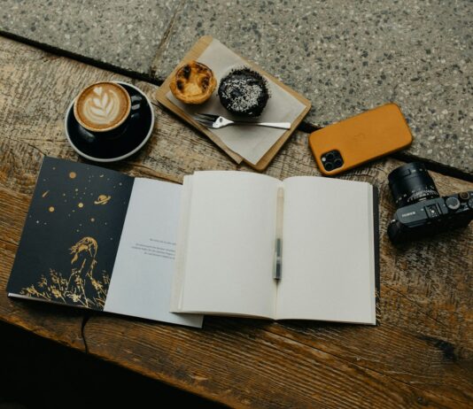스트레스, 작은 생활 변화로 큰 평화 찾기 an open book sitting on top of a wooden table next to a cup of coffee